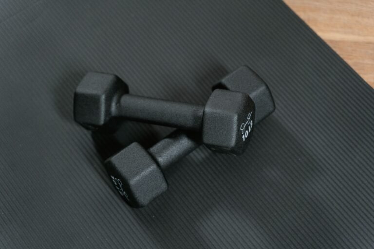 Dumbbells on a yoga mat for home workouts without a gym