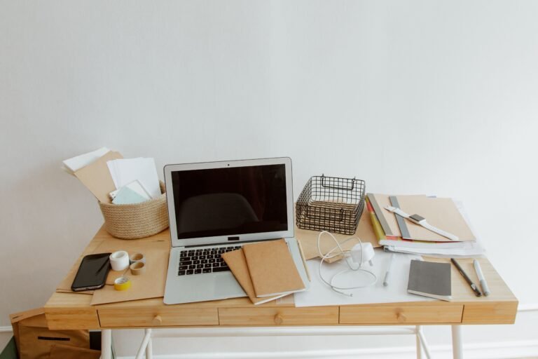 Clean organized desk with laptop and planner for productive work