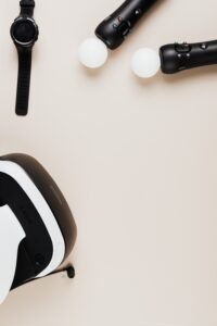 Tech gadgets including a VR headset and smartwatch on a desk