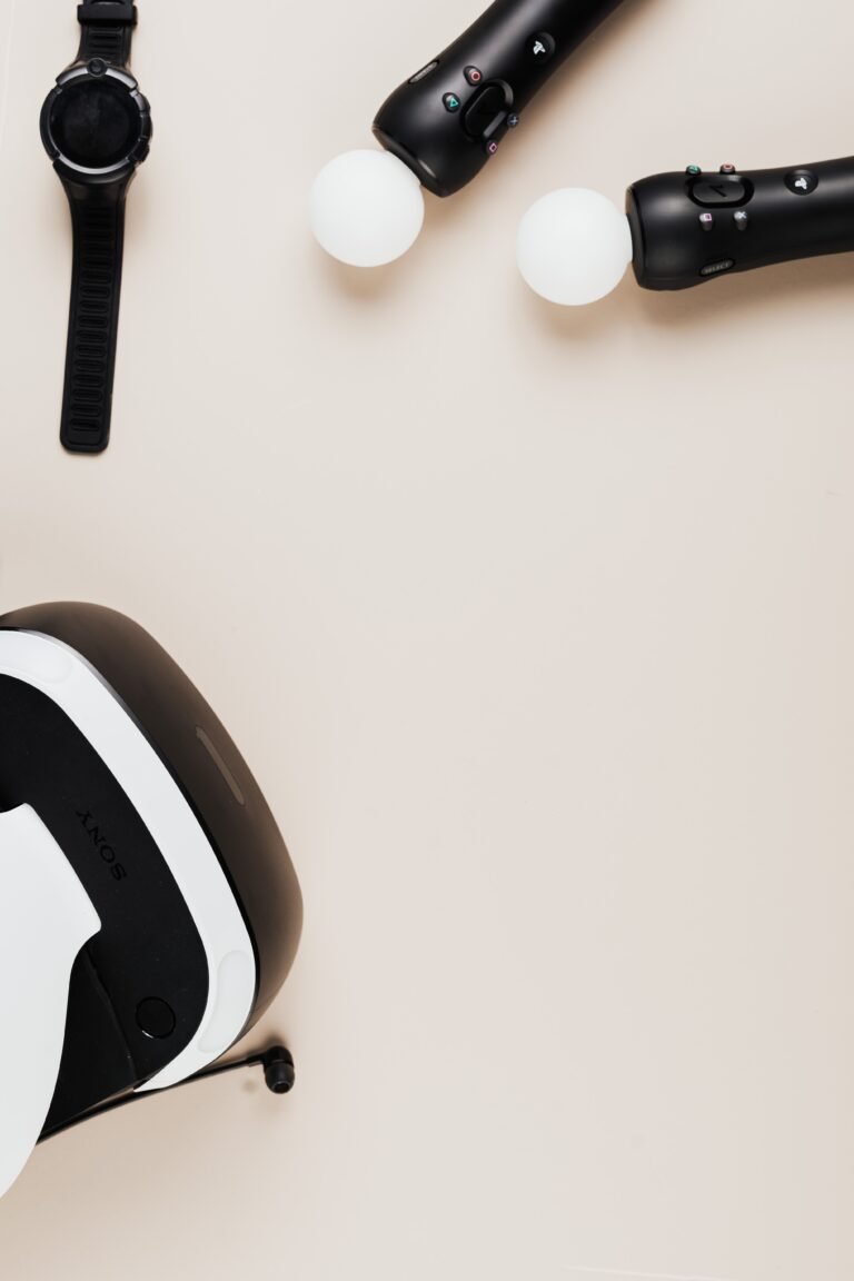 Tech gadgets including a VR headset and smartwatch on a desk